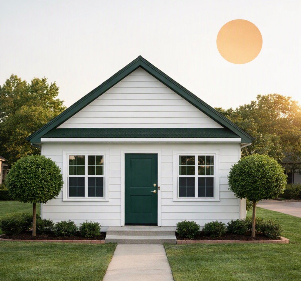 White house with a green front door, landscaped lawn, and trees